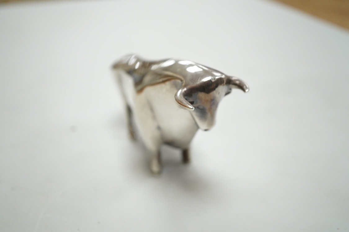 A stylised white metal (stamped 925) miniature model of a bull, length 11.5cm, height 7cm, 30oz.